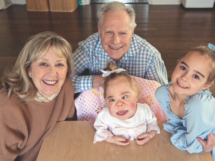 A family photo taken from above. Reese Paltrow is in the middle. She's surrounded by her sister and great aunt and great uncle.