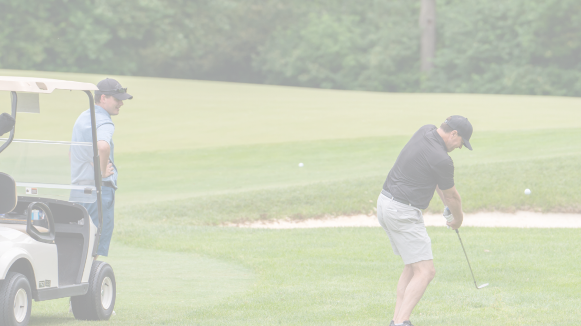 man on golf course putting