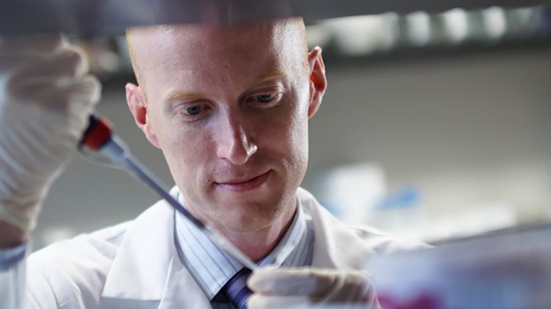 A close-up photo of a researcher working in a laboratory.